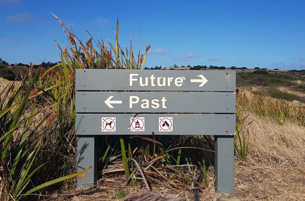 Beach sign showing "future" pointing in one direction and "past" pointing in the other
